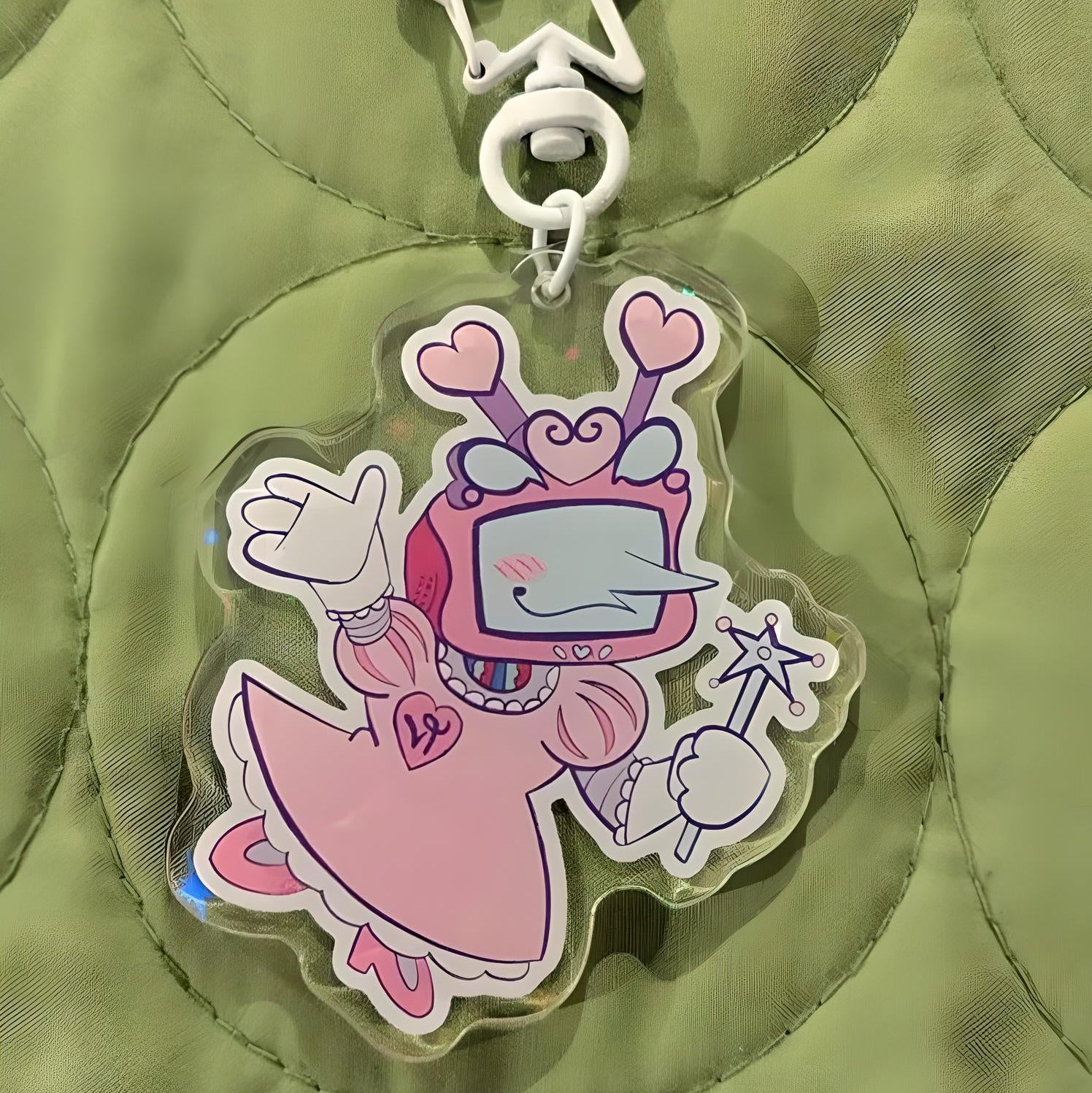 Detail of the durable acrylic material and metal keyring on the DELTARUNE Tenna Princess Keychain.
