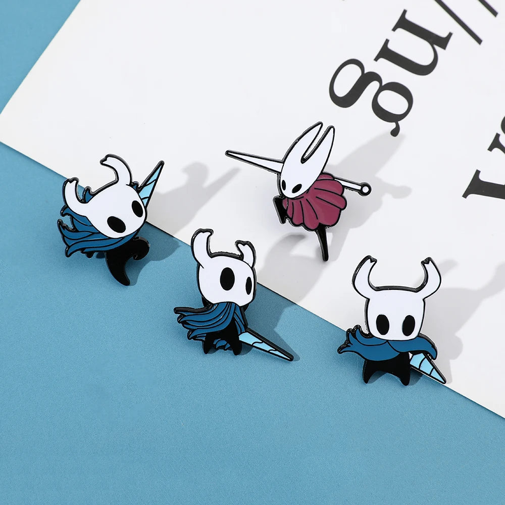 Close-up of cute Hollow Knight metal pin showing vibrant colors.