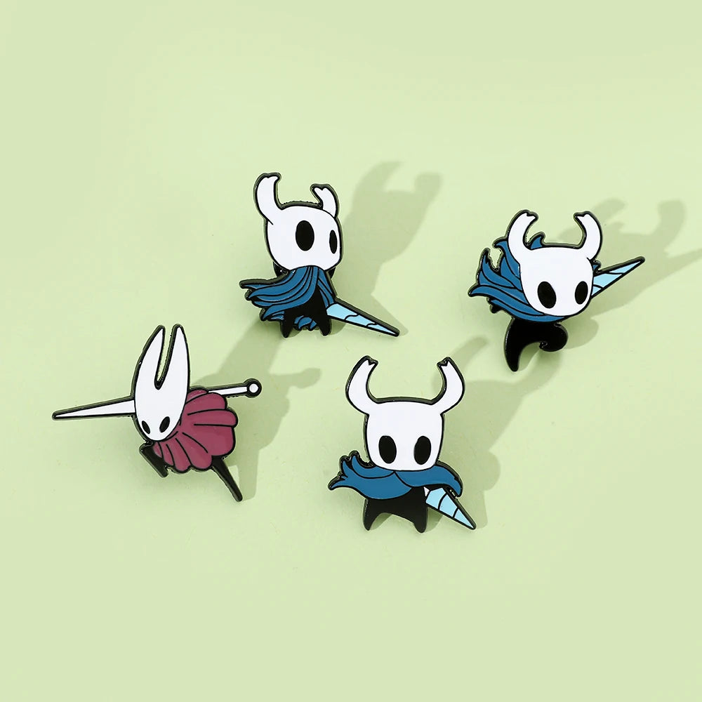 Close-up of cute Hollow Knight metal pin showing vibrant colors.