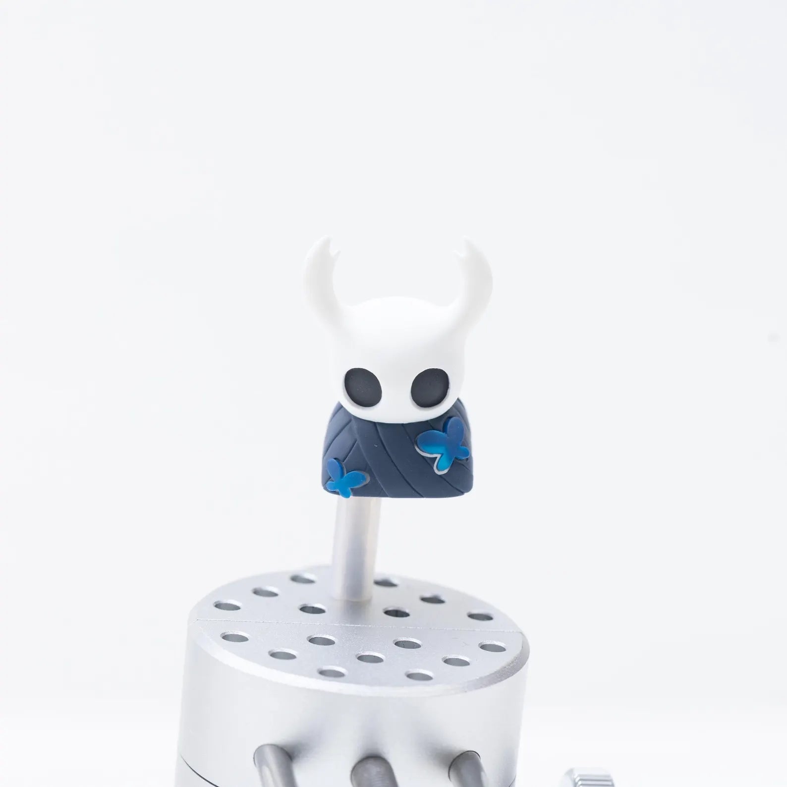 Close-up detail of the resin sculpt of The Knight Hollow Knight Keycap, highlighting the translucent material.