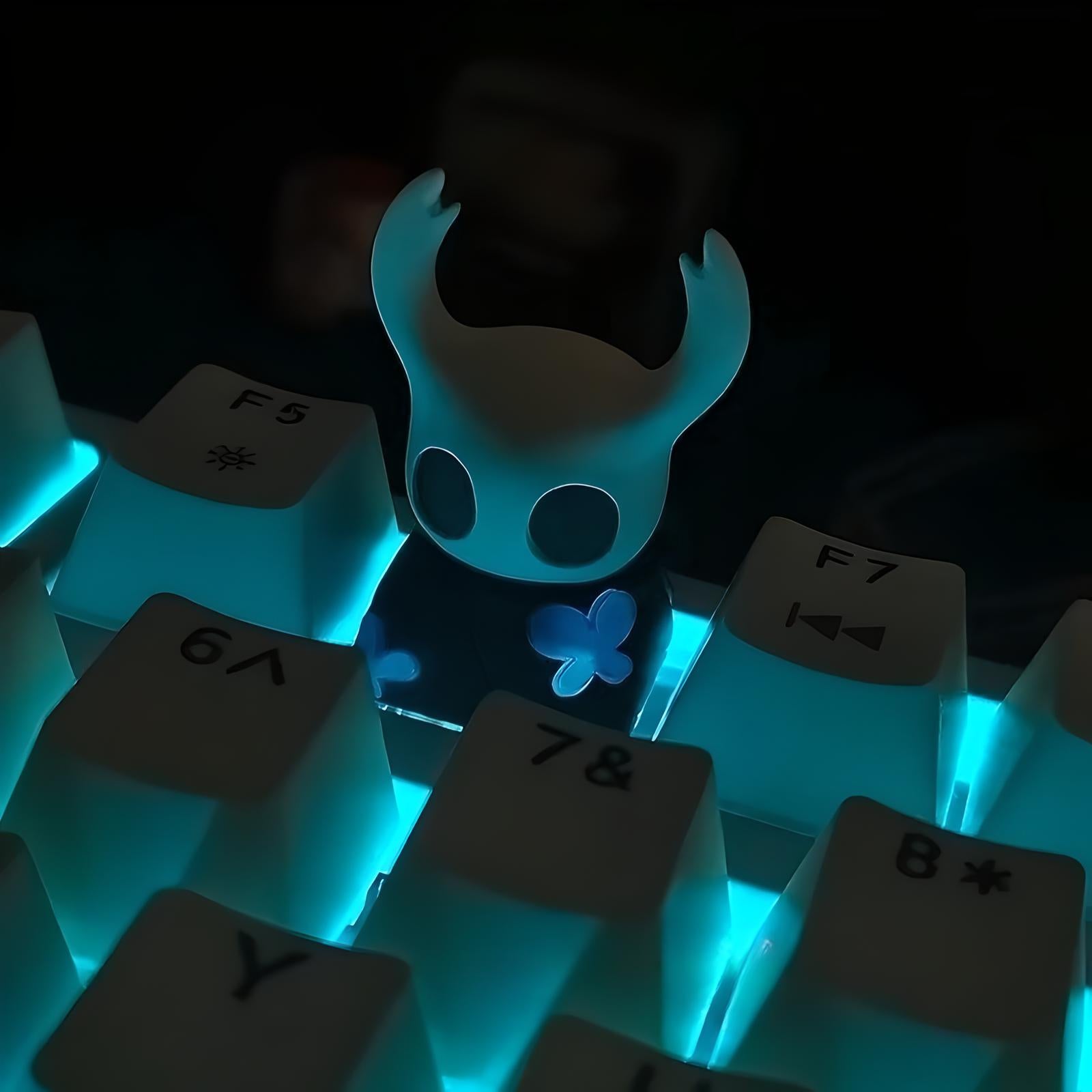 Close-up detail of the resin sculpt of The Knight Hollow Knight Keycap, highlighting the translucent material.