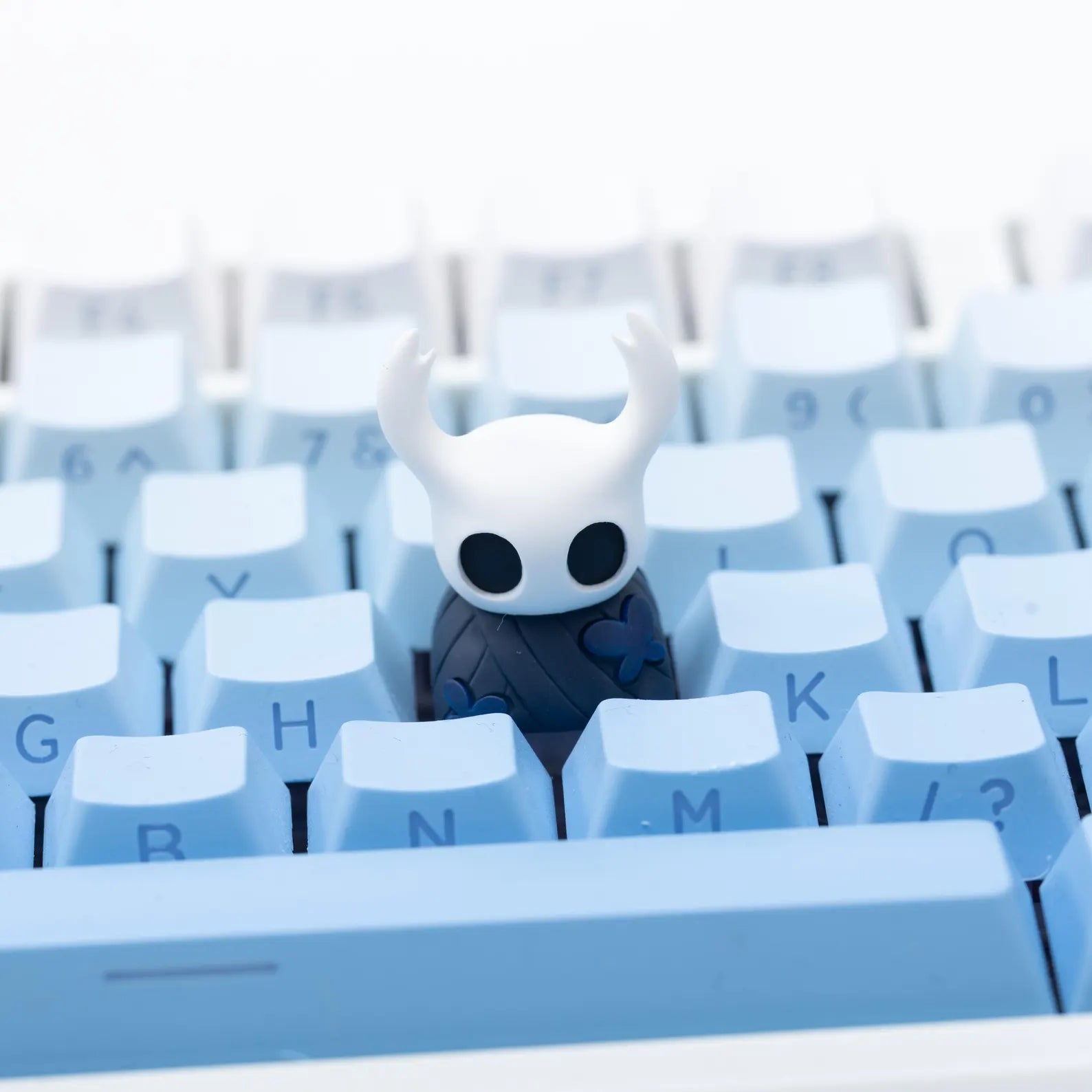 Front view of the translucent resin Hollow Knight Keycap featuring The Knight for the ESC key.