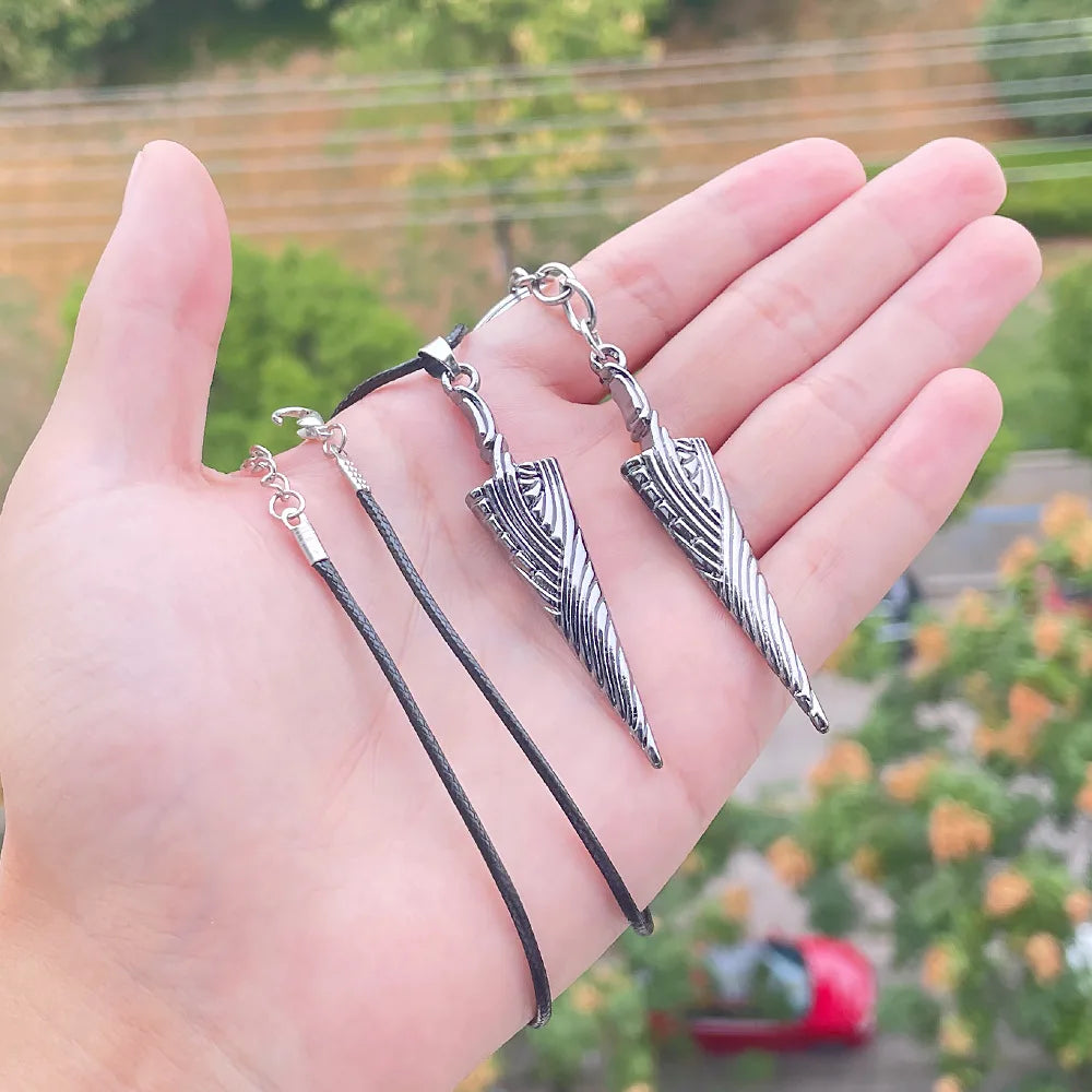 The Knight's Nail keyring held in hand for size, a Hollow Knight game weapon accessory