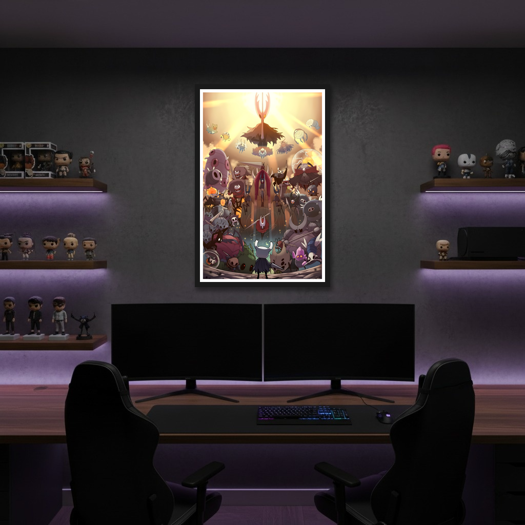 Framed Hollow Knight Poster displayed above a gaming setup, showcasing the unique fan art style