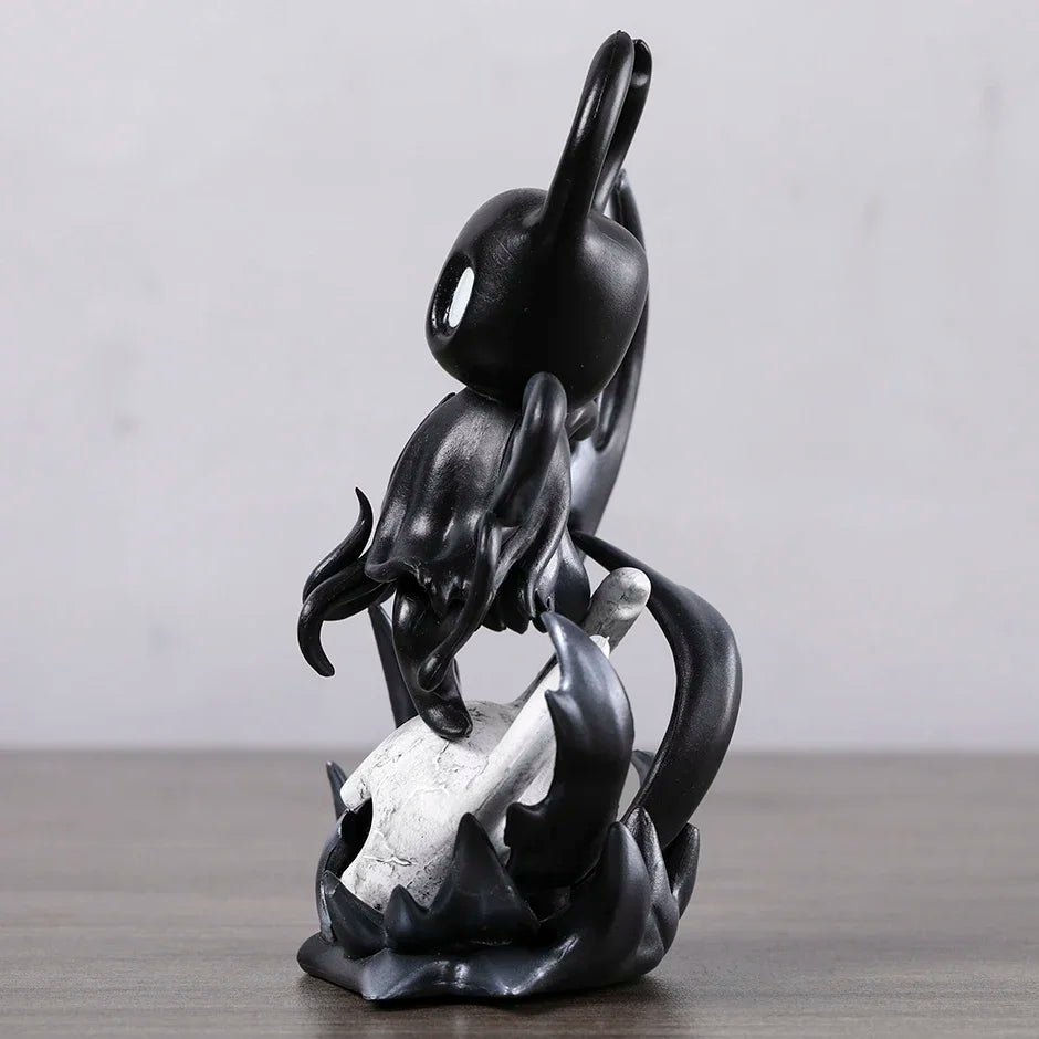 Side view of Hollow Knight Shade figure, showing void design