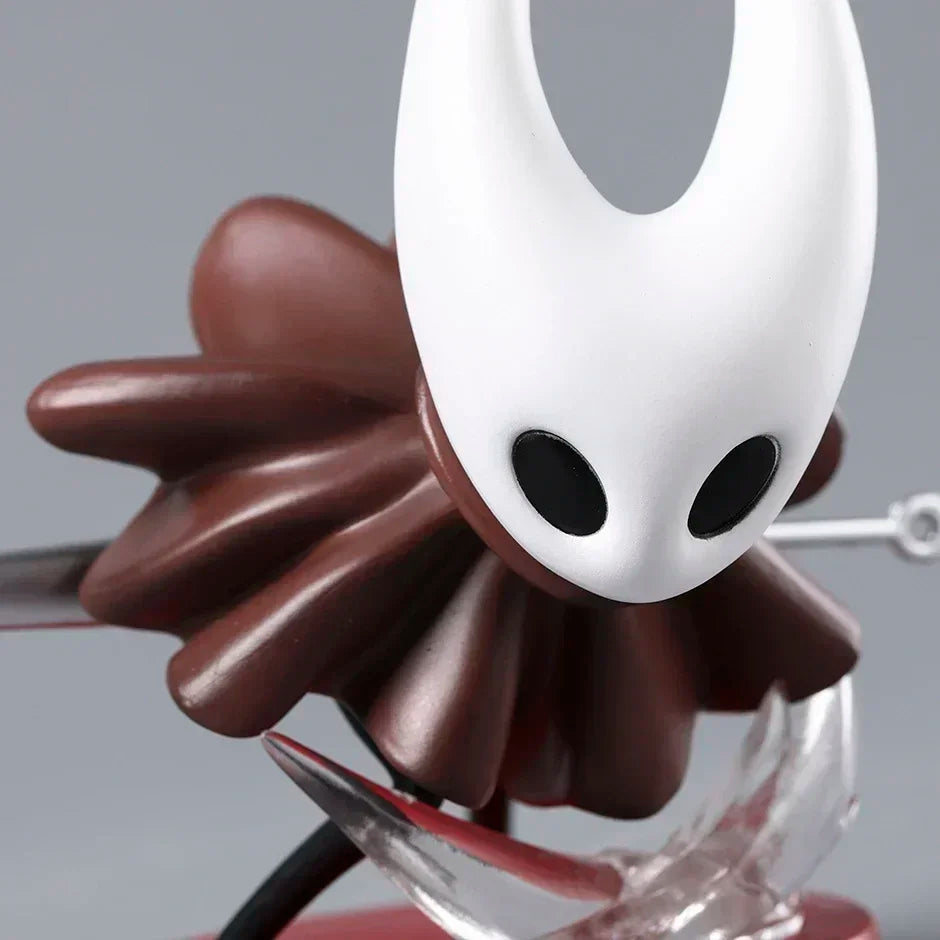 Hollow Knight Hornet figure on a gaming desktop setup