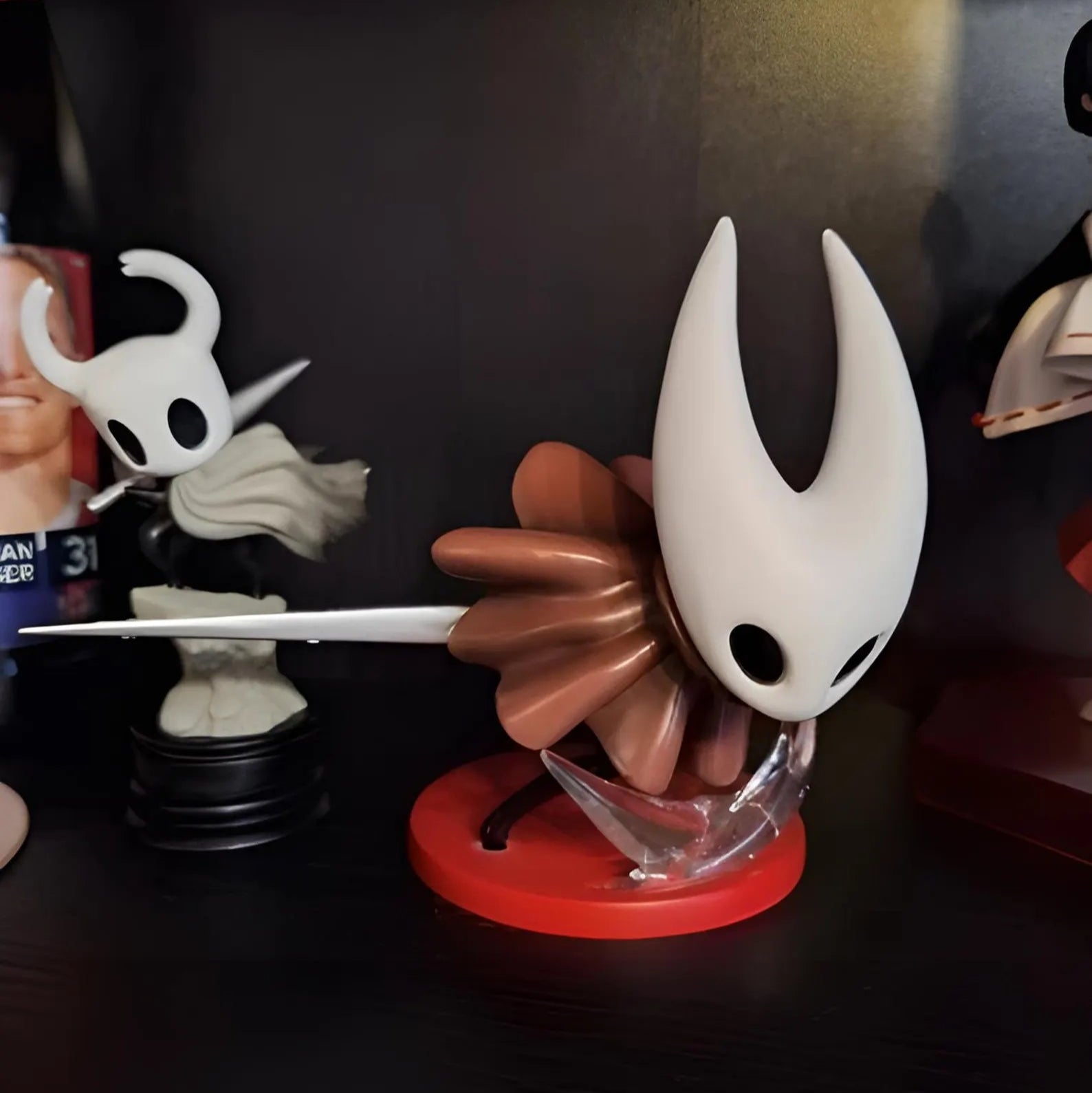 Close-up of the detailed sculpt of Hornet's iconic needle on the Silksong collectible figure