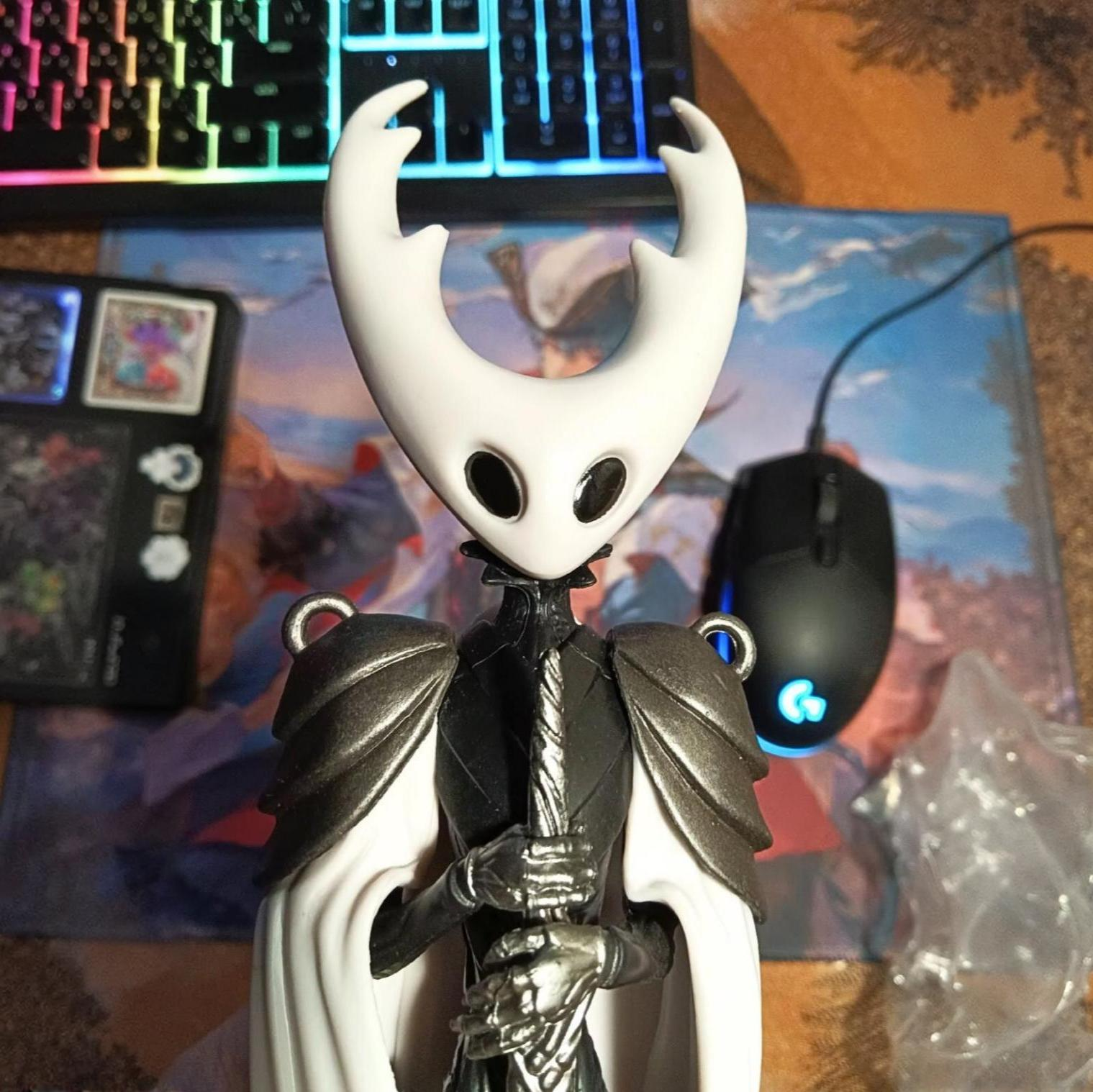 The Pure Vessel Figure displayed on a desktop with dramatic lighting, emphasizing its status as a premium Vessel Collectible.
