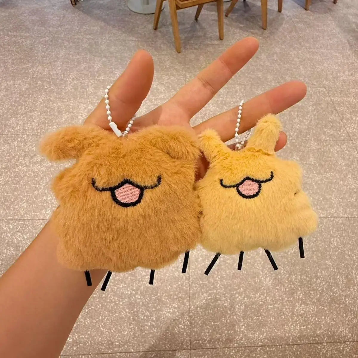 Close-up of the Silksong Flea Plush, demonstrating the soft material and highlighting the squeaker feature