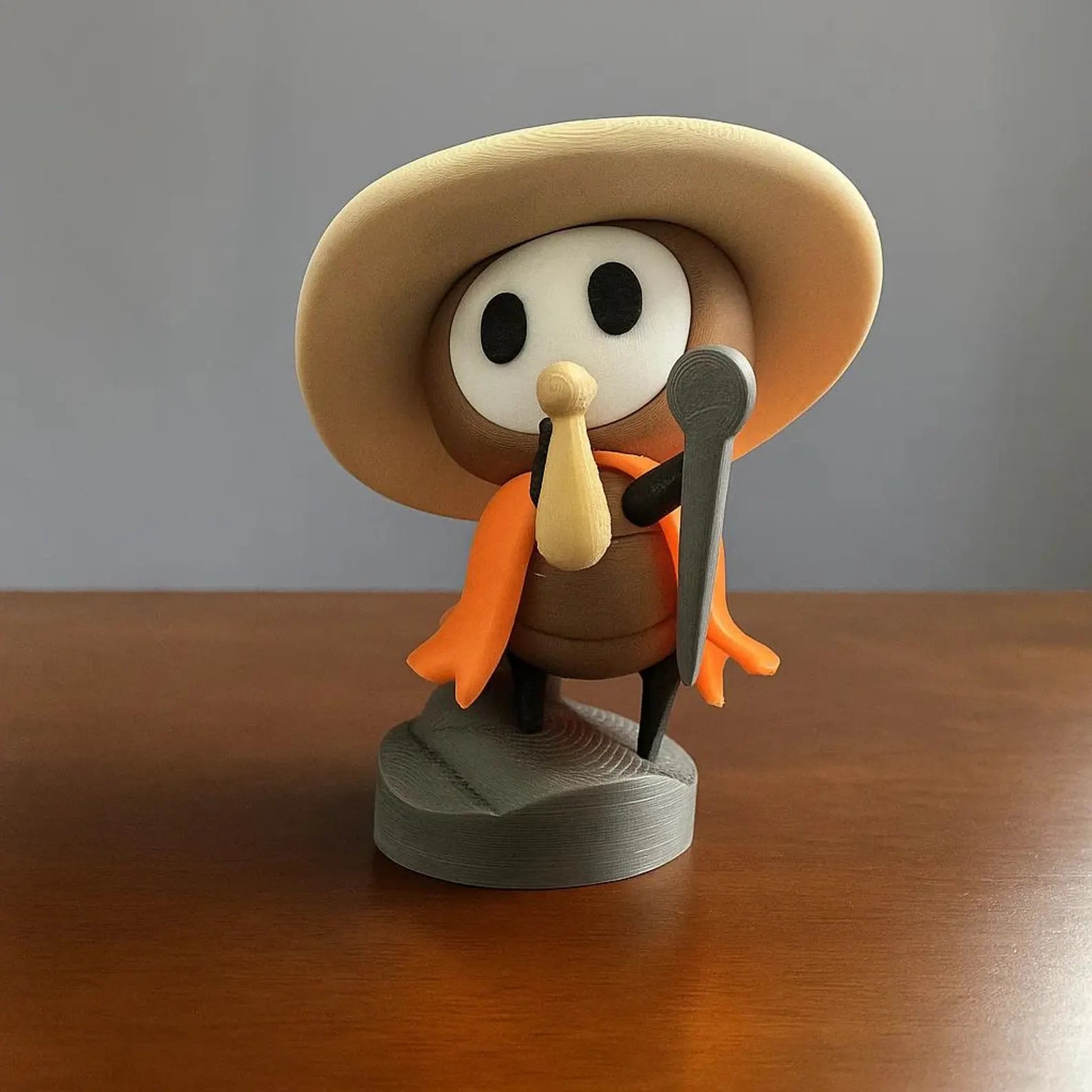 Sherma Resin Figure displayed on a gaming desktop next to a monitor, acting as a cute desktop ornament