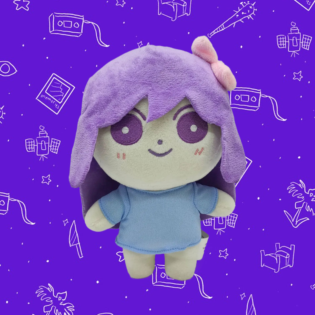 Close-up of the AUBREY Plush Toy's face and pink hair, highlighting the detailed stitching and soft short plush material.