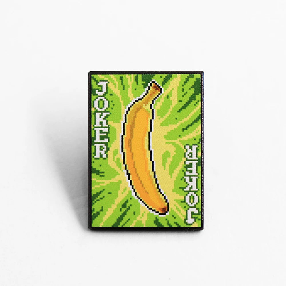 Front view of the Banana Joker Enamel Pin, featuring the smiling Gros Michel design.