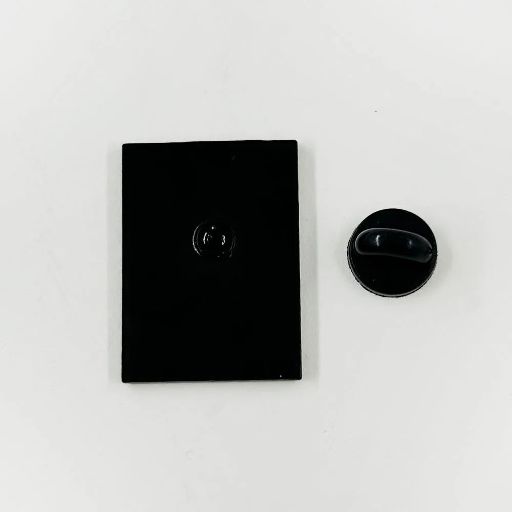 Black rectangular object with a circular component on a white background