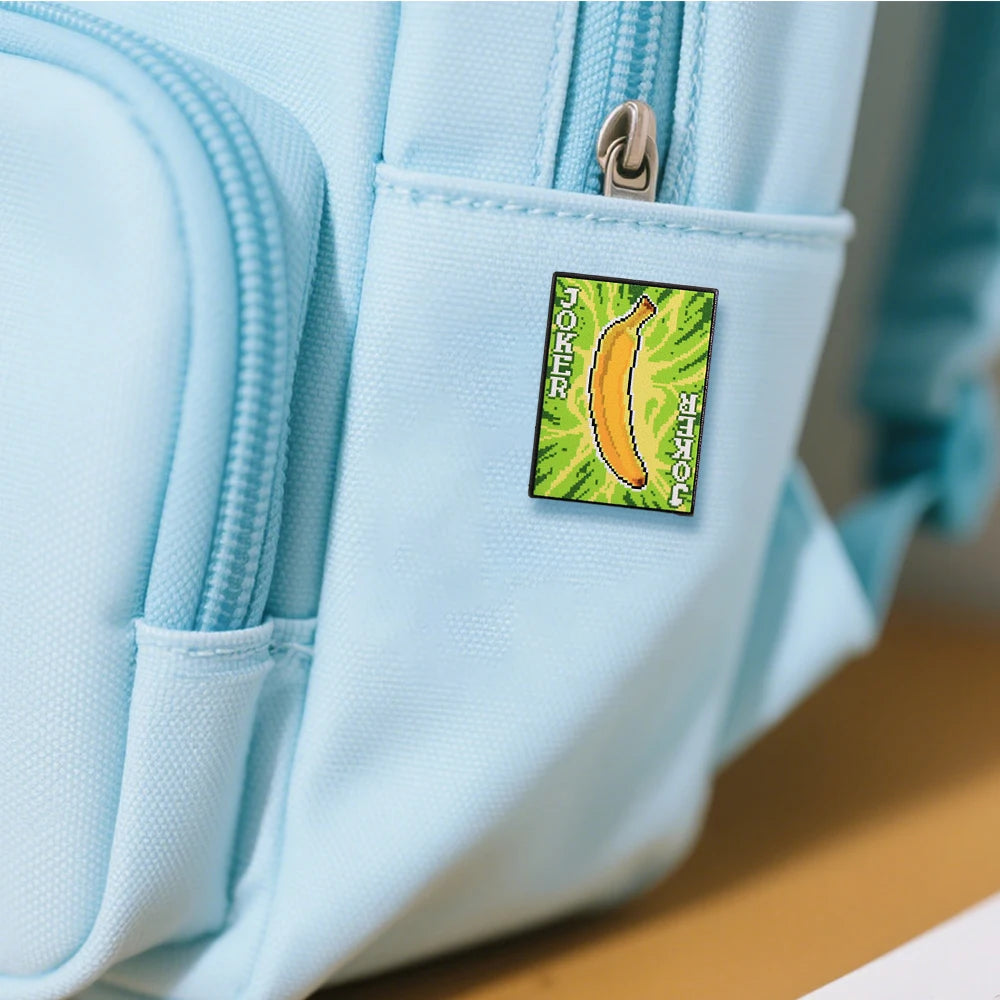 The Banana Joker pin attached to a backpack, showcasing it as a stylish gaming accessory.