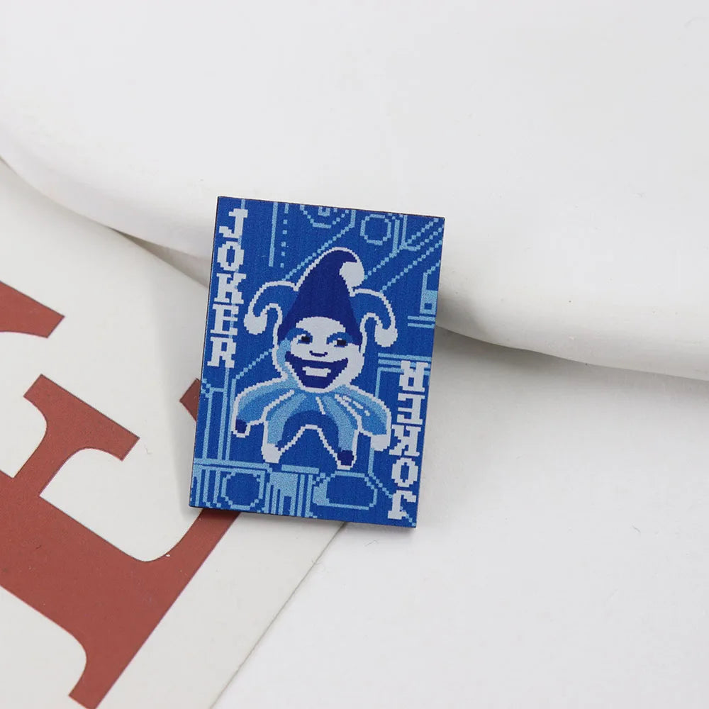 Blueprint Joker Enamel Pin with a jester design and text on a white surface