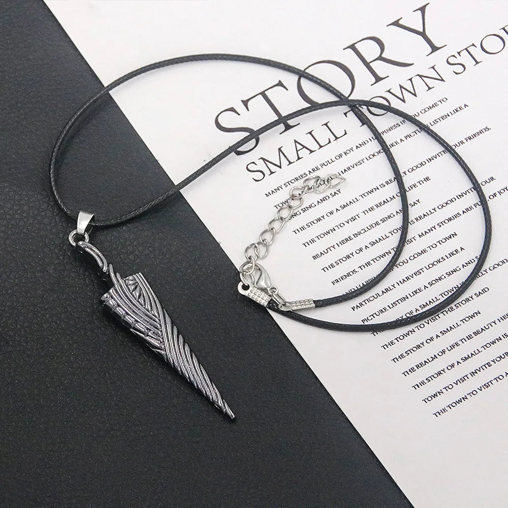 Detailed view of the Hollow Knight Nail Sword keychain, showing intricate metal pendant craftsmanship