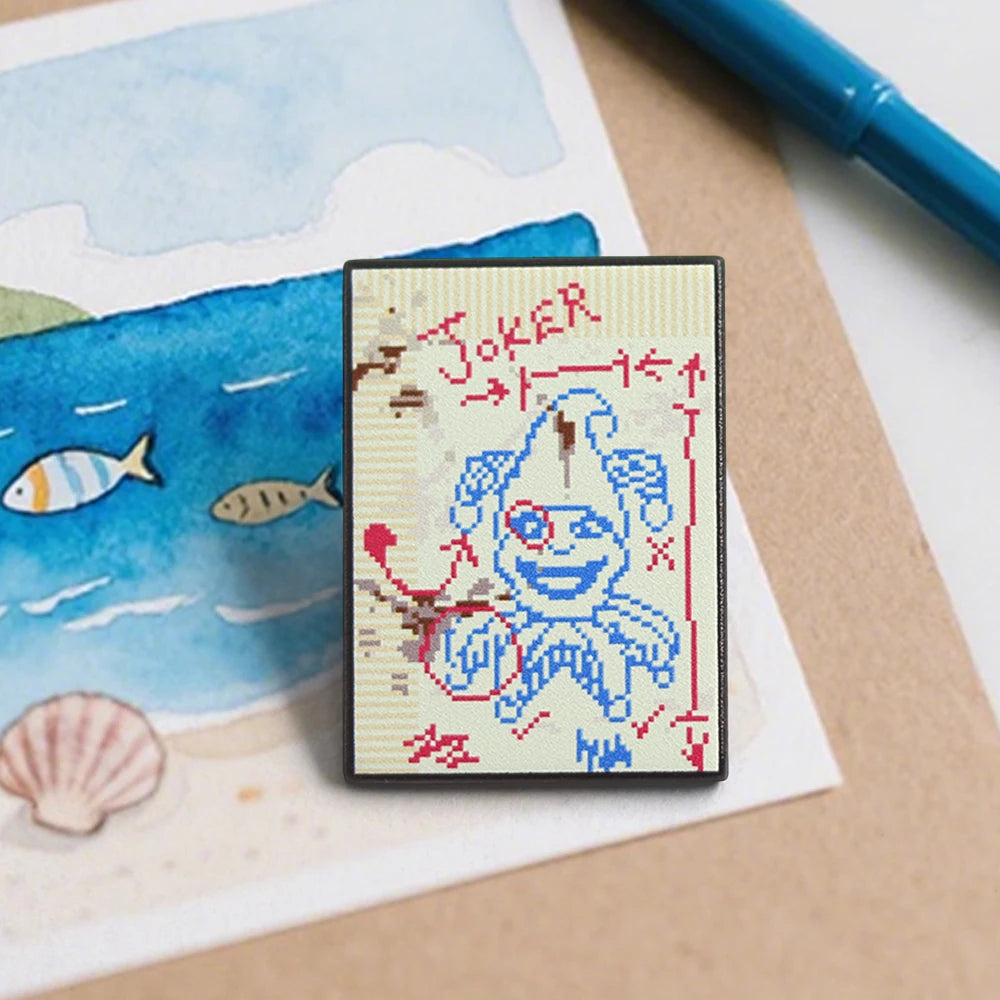 Close-up of the hard enamel quality and vibrant colors of the Brainstorm Joker fan merch.