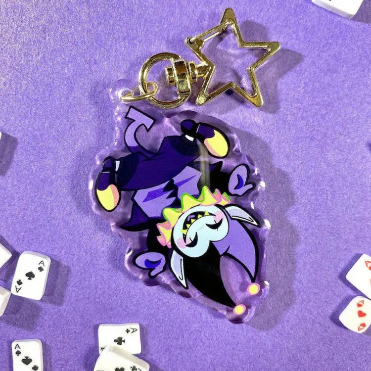 Detail of the durable acrylic material and metal keyring on the DELTARUNE Merch Jevil Keychain.