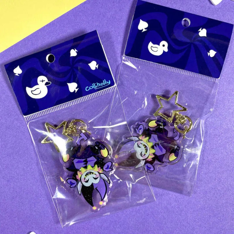 Detail of the durable acrylic material and metal keyring on the DELTARUNE Merch Jevil Keychain.