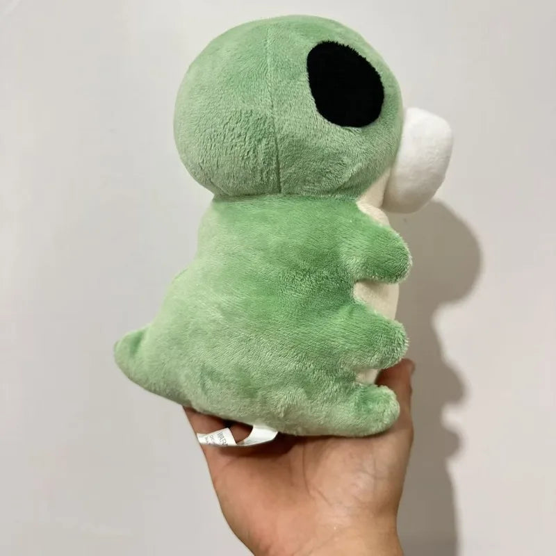 Close-up of the soft green fleece fabric and stitching of the Hollow Knight inspired Grub plushie