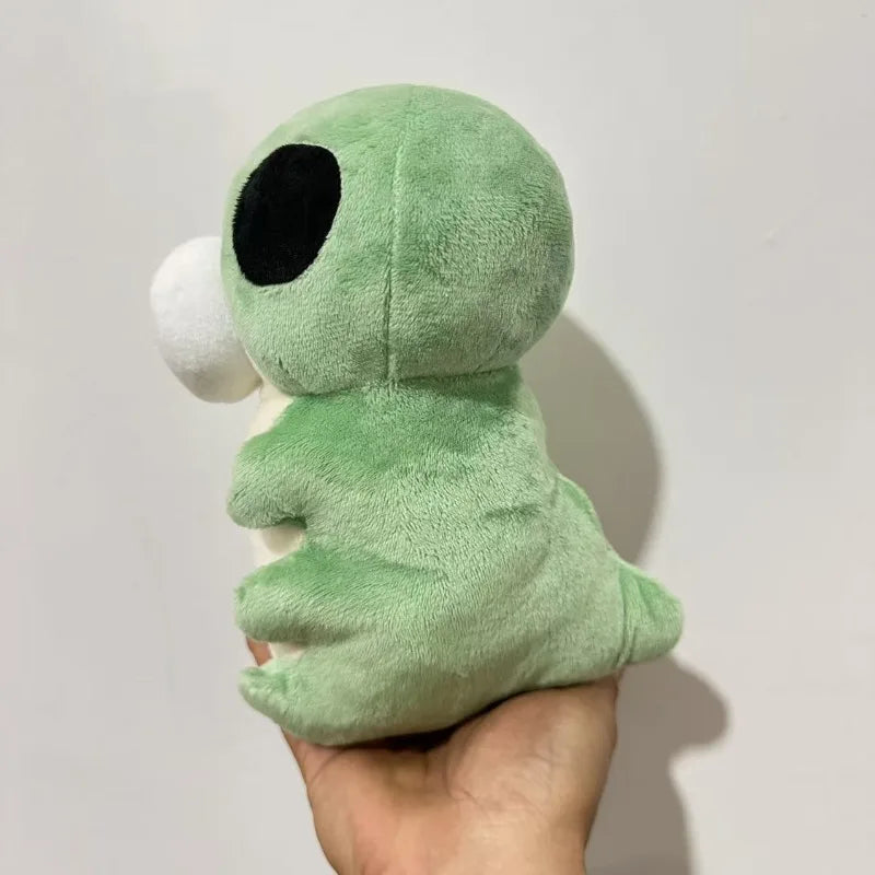 Close-up of the soft green fleece fabric and stitching of the Hollow Knight inspired Grub plushie
