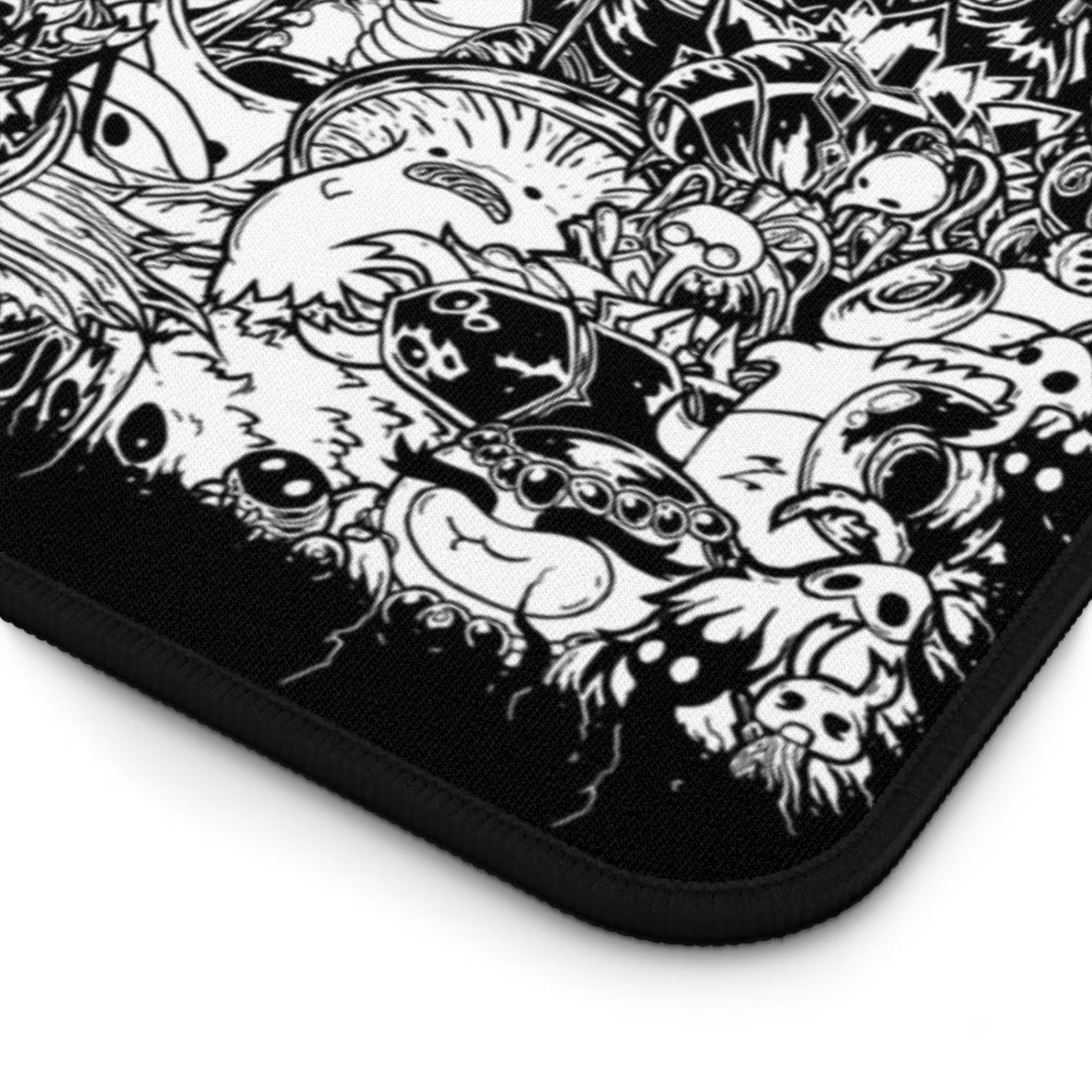 Underside view of the textured non-slip natural rubber base on the Hollow Knight characters desk mat.