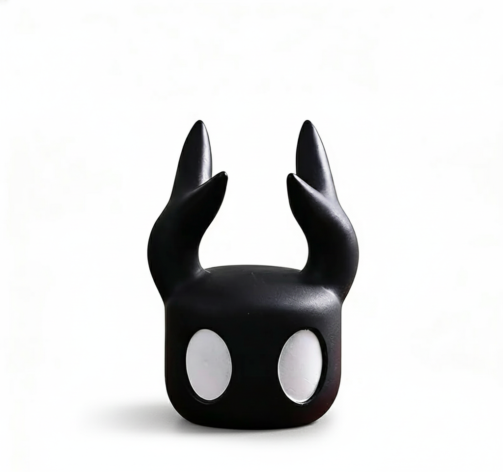Front view of the Hollow Knight Controller Stand Black (4.6in Tall) designed as The Knight's head, ready to hold a gamepad.