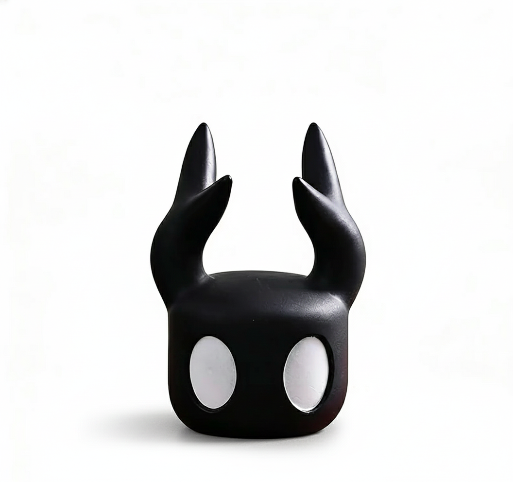 Front view of the Hollow Knight Controller Stand Black (4.6in Tall) designed as The Knight's head, ready to hold a gamepad.