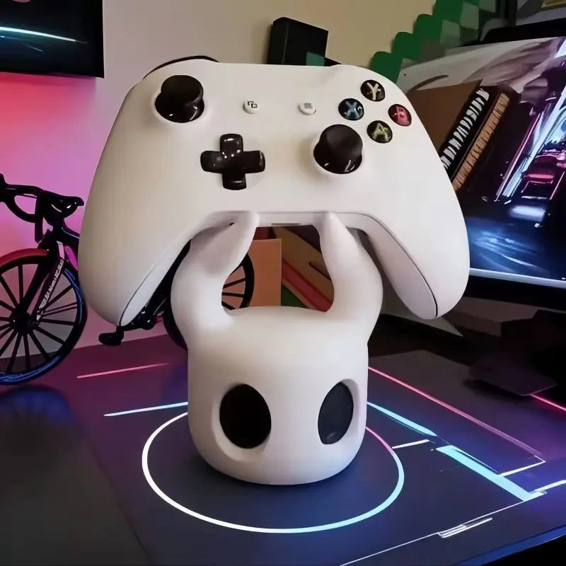 The Hollow Knight Controller Stand holding a game controller, demonstrating its functional use as Hollow Knight Merch.