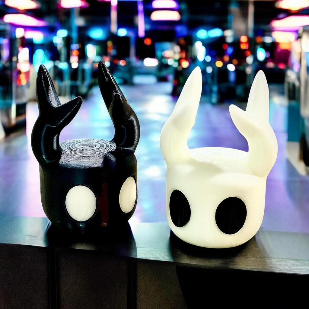 The Hollow Knight Controller Stand holding a game controller, demonstrating its functional use as Hollow Knight Merch.