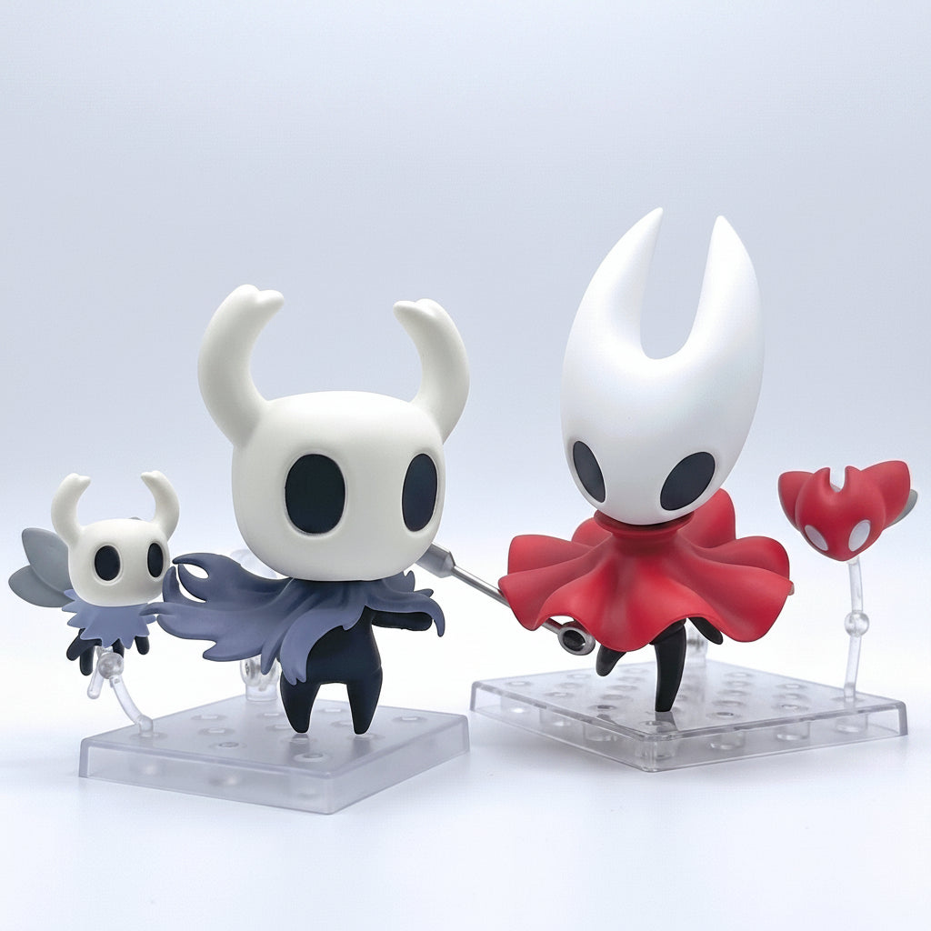 The Knight and Hornet figurines from Hollow Knight on clear stands against a light gray background