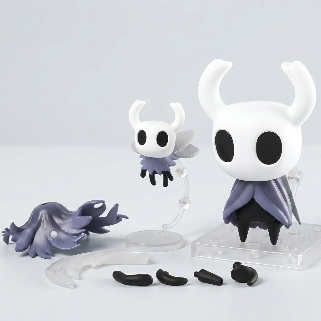 Set of Hollow Knight figurines with additional parts on a light gray background