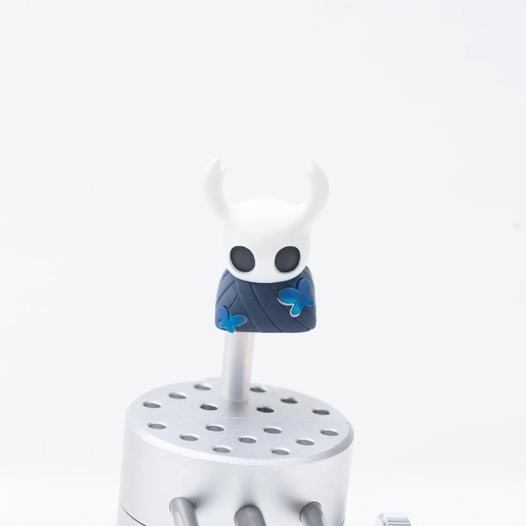 Close-up detail of the resin sculpt of The Knight Hollow Knight Keycap, highlighting the translucent material.