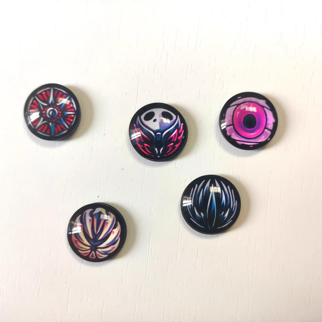 Close-up detail of one of the charms/talismans in the Hollow Knight Magnetic Charm Set (2.5cm/1.0in), highlighting the paint quality.