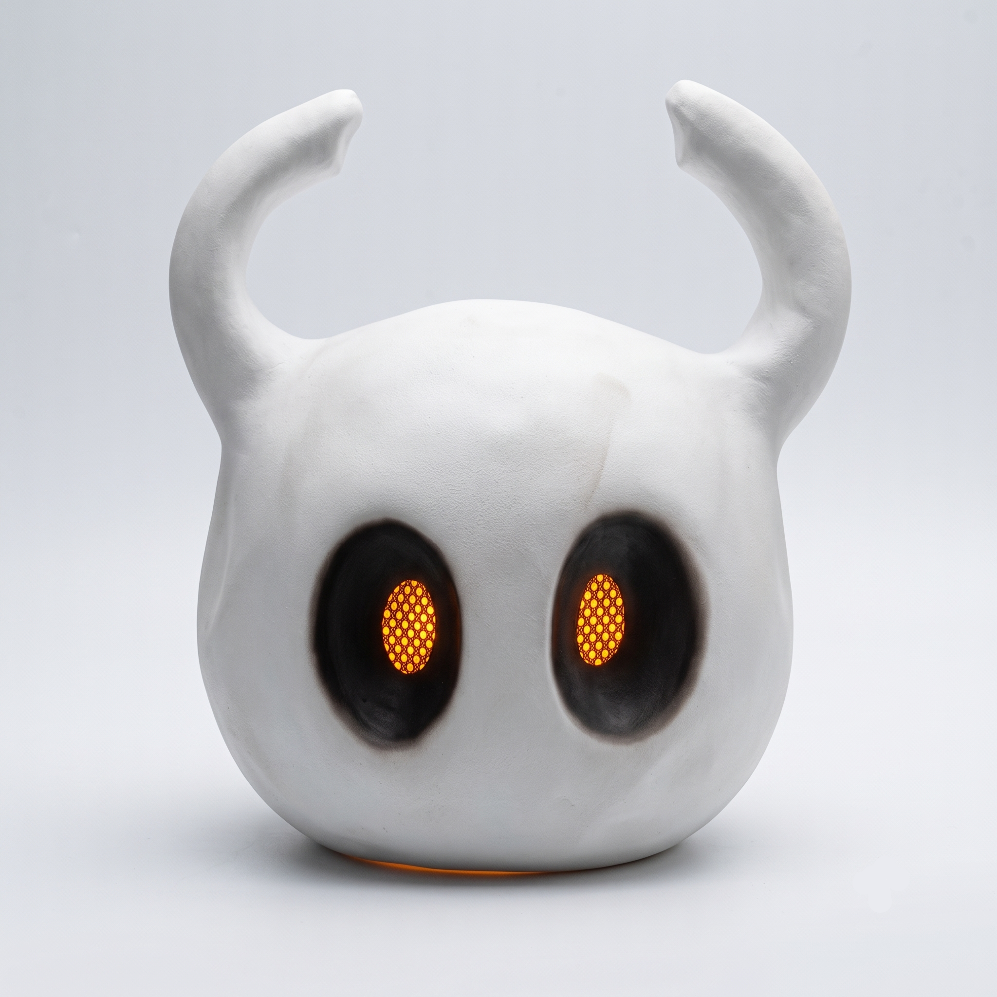 Front view of the wearable Hollow Knight mask showing the horned shell sculpt, ideal for The Knight cosplay.
