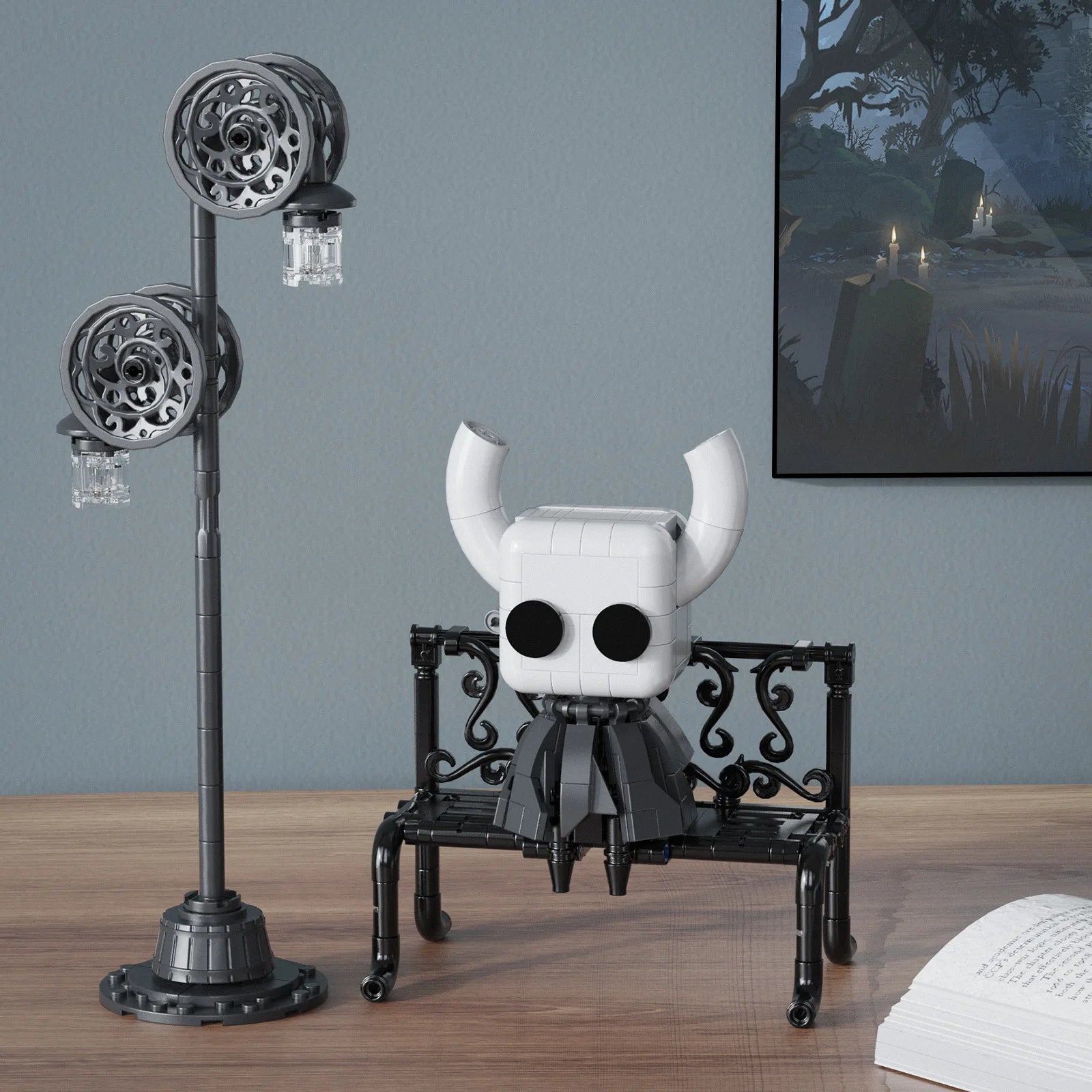 The finished Hollow Knight MOC Toy displayed next to a gaming setup, showcasing the unique collectible.