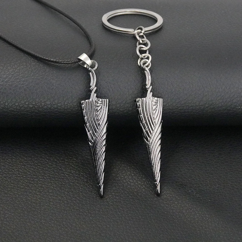 Close-up of Hollow Knight Bone Nail pendant showing metal texture