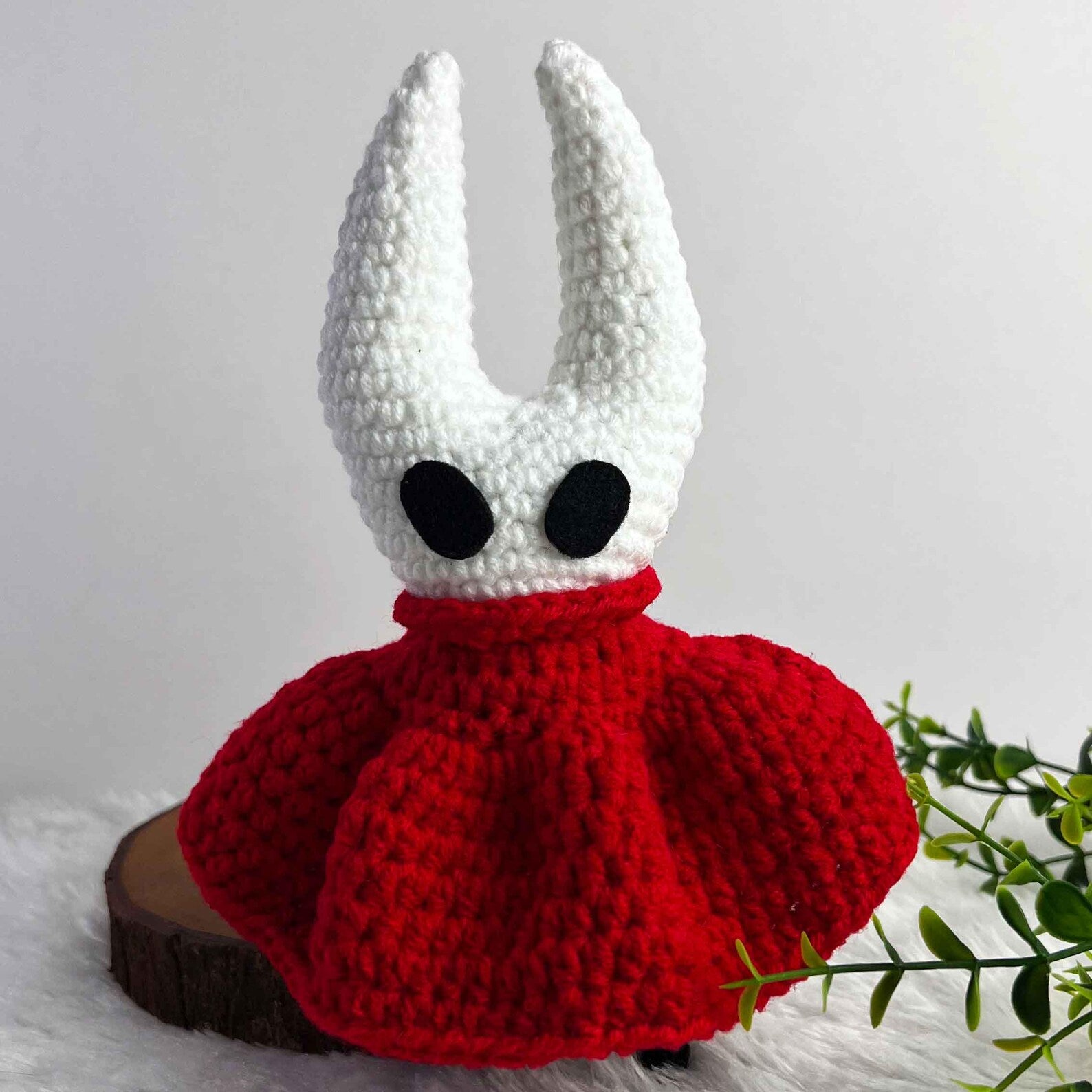 The Hornet Crochet Doll displayed in a cozy setting, emphasizing the warmth and charm of this handmade Silksong Merch.