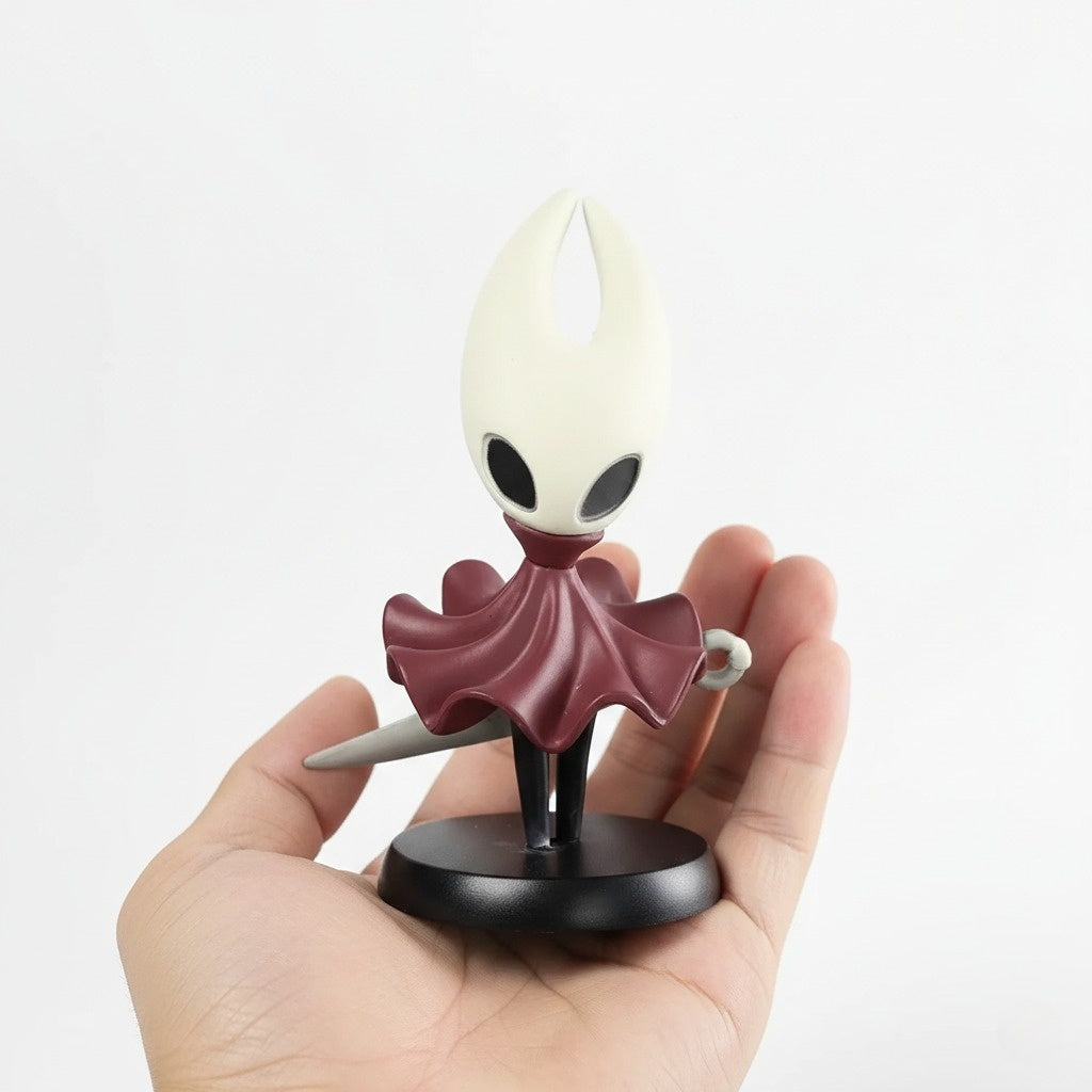 The Hornet Mini Figure held in a hand for size reference, showcasing its portability.