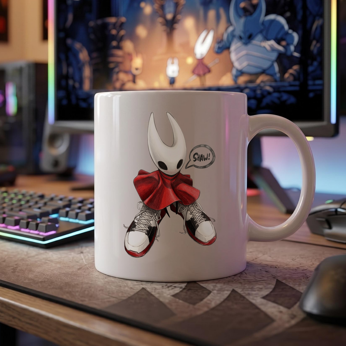 The Hornet shoes meme mug resting on a gaming desk beside a mechanical keyboard, showing fan-inspired Hollow Knight Silksong merch.