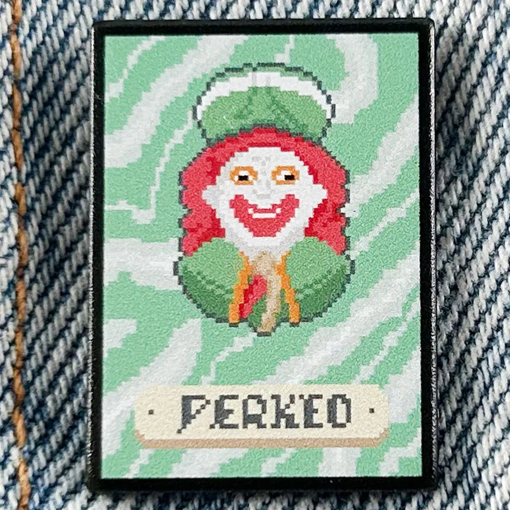 Close-up of the hard enamel quality and silver-tone plating on the Perkeo Joker fan merch pin.