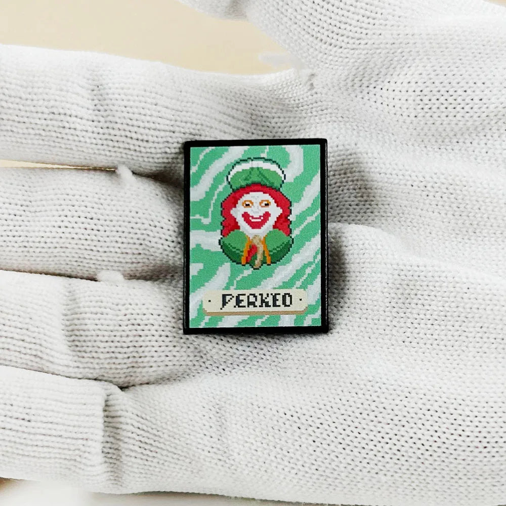 Close-up of the hard enamel quality and silver-tone plating on the Perkeo Joker fan merch pin.
