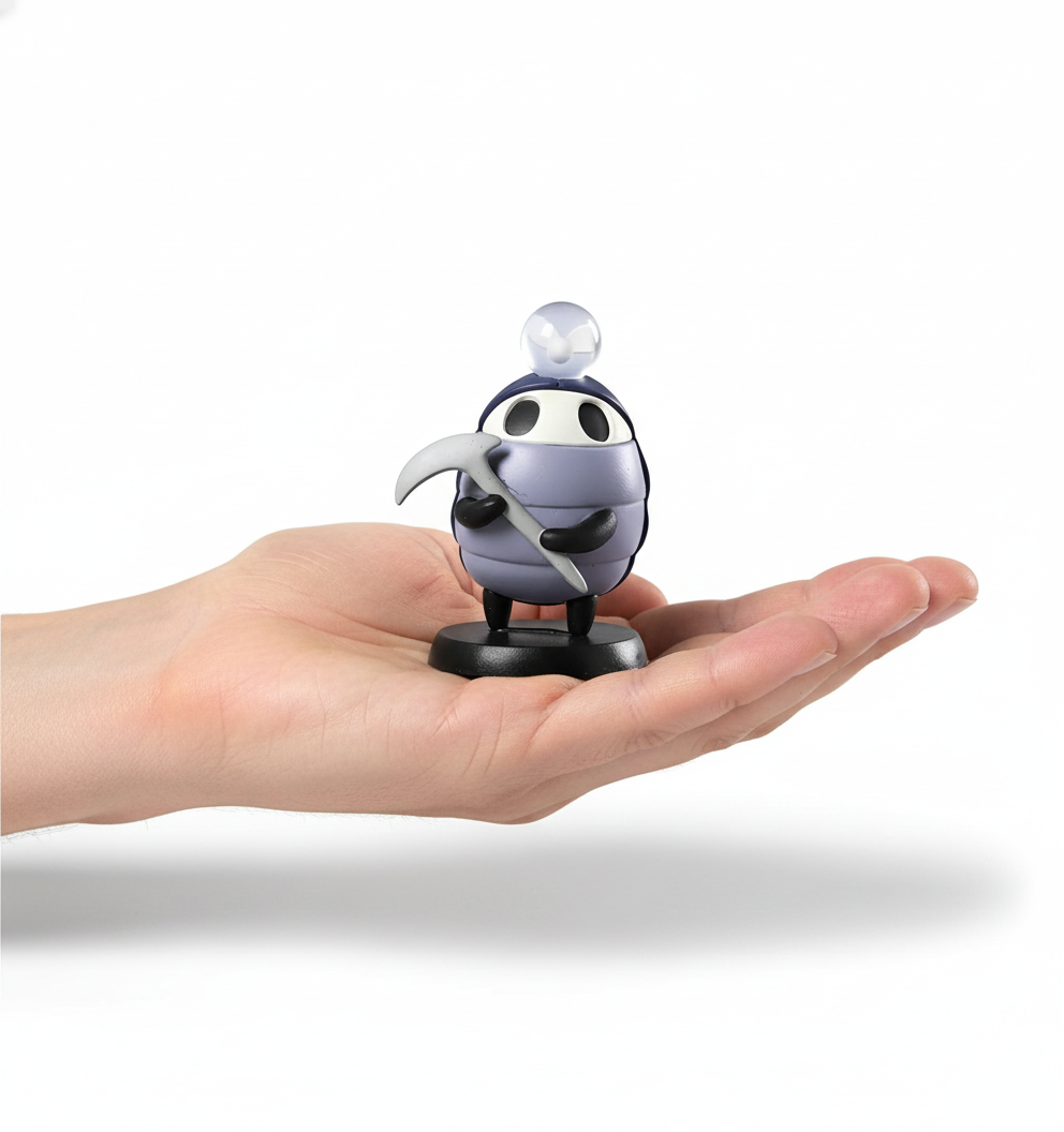 The Myla Mini Figure held in a hand for size reference, showcasing its portability.