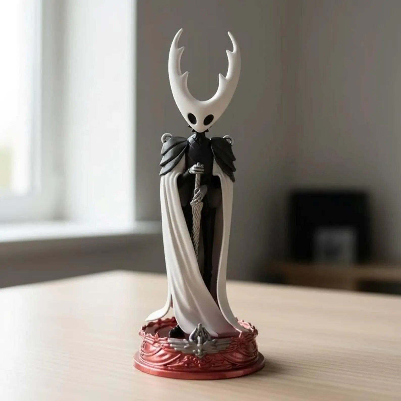 Front view of The Pale King action figure in a dominant pose, a premium Hollow Knight collectible