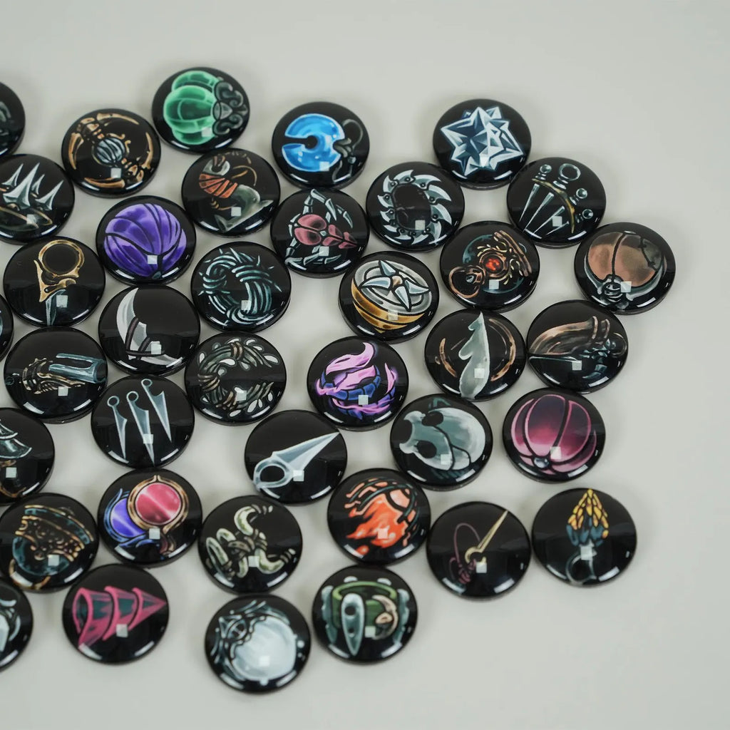 Collection of Silksong Charms with various charms from the game on a light gray background
