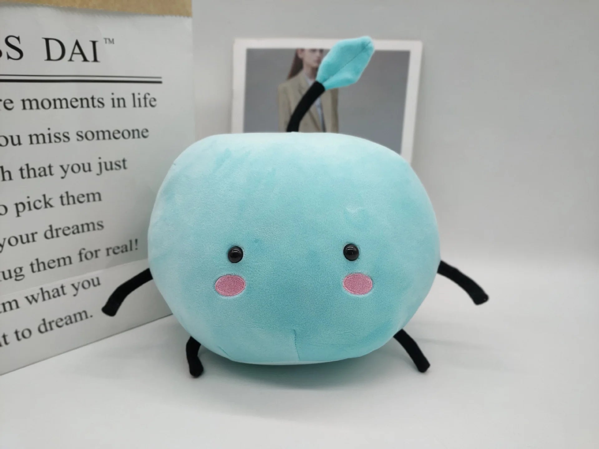 Vibrant blue Stardew Valley Junimo stuffed toy with a red accent, a cheerful home decor piece.