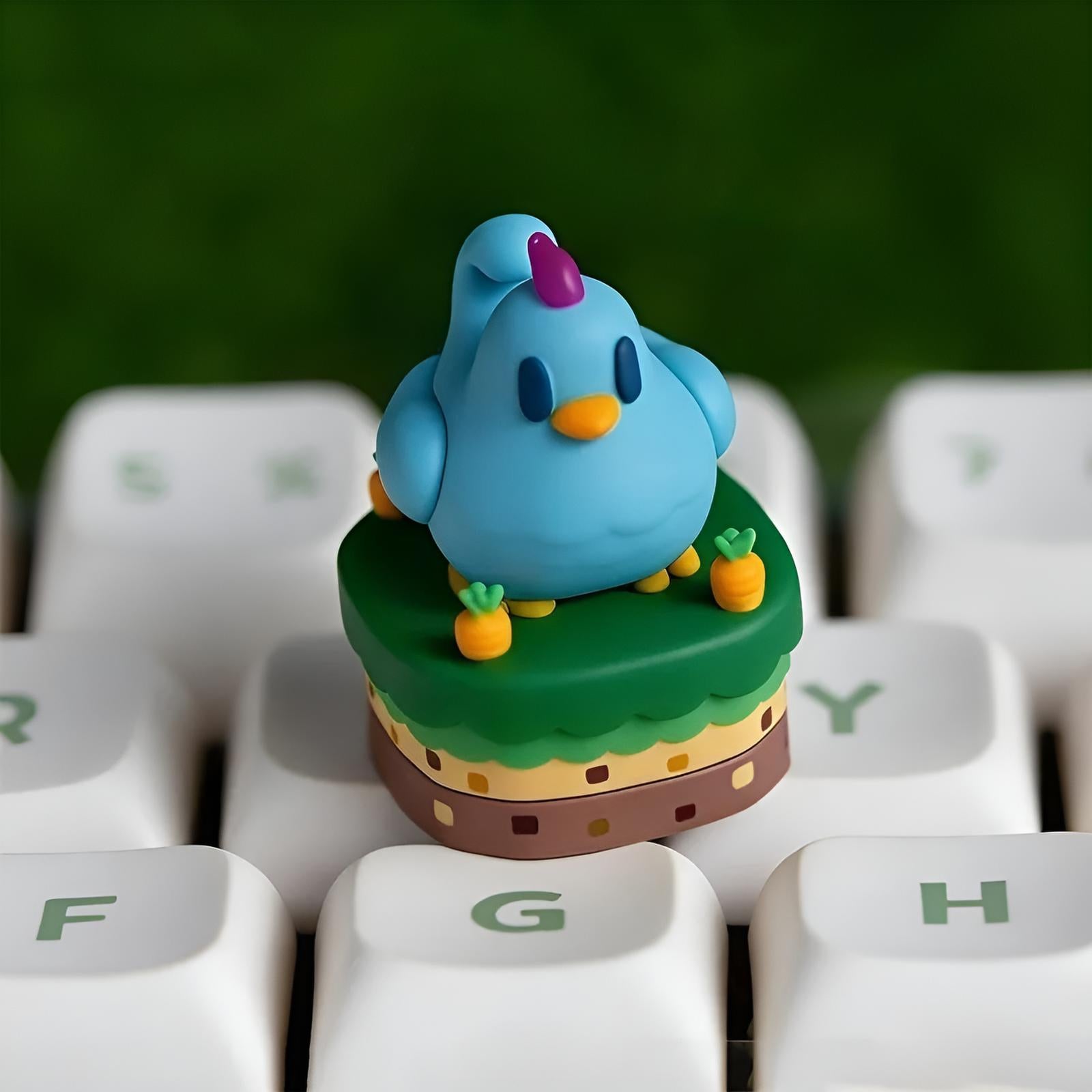 Close up of a Stardew Valley blue Chicken Keycap on a mechanical keyboard, Stardew Valley Merch