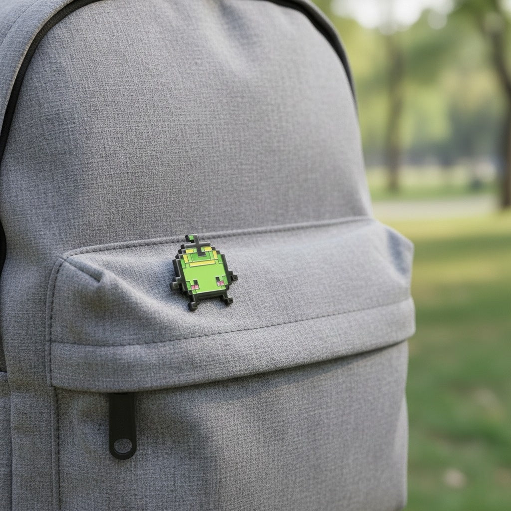 The Junimo Enamel Pin pinned to a backpack, showing its size and vibrant colors as a Stardew Valley accessory