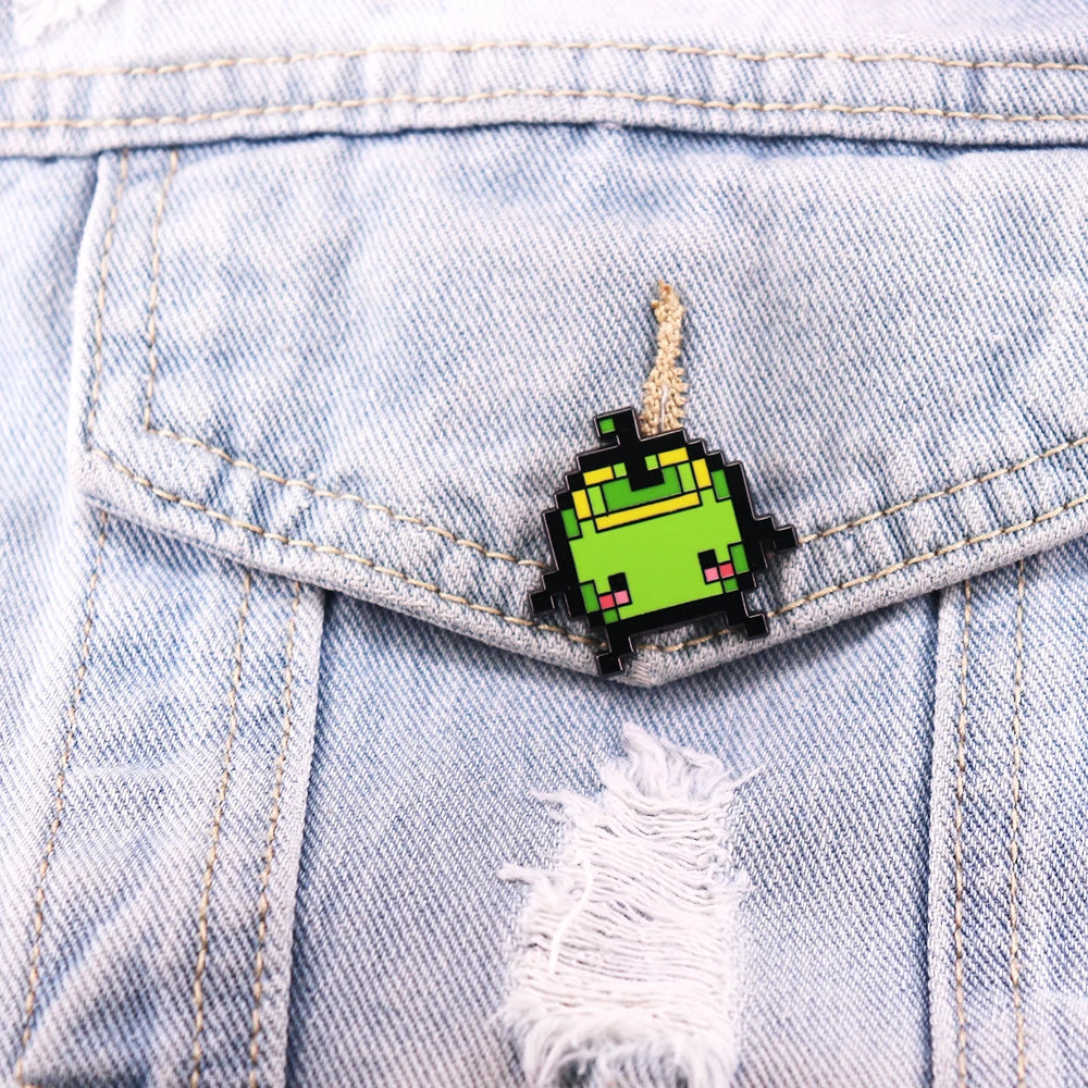 The Junimo Enamel Pin pinned to a denim jacket, showing its size and vibrant colors as a Stardew Valley accessory