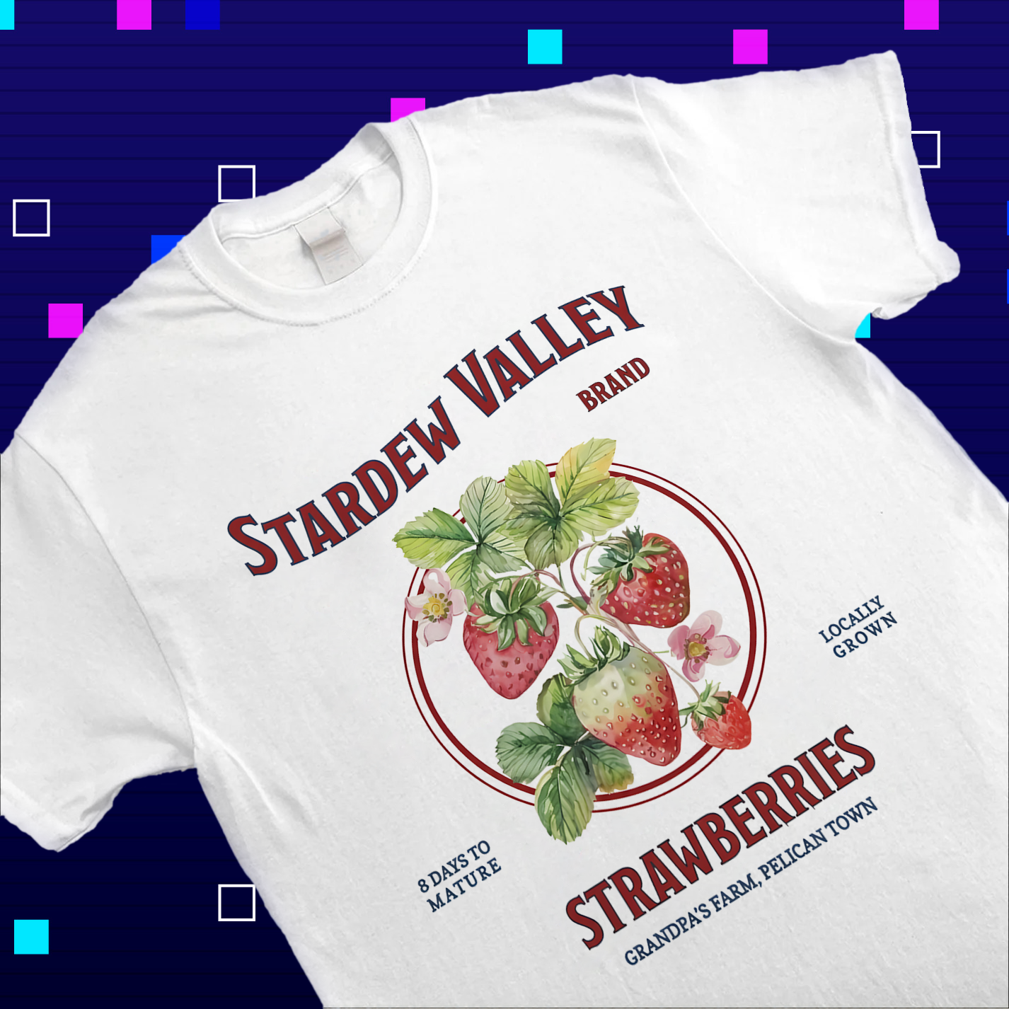 Close-up of the vintage strawberry and Pelican Town typography print on a high-quality cotton shirt